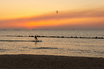 Image showing Man on board glides over the wave