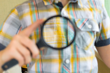 Image showing Lad with magnifying glass close