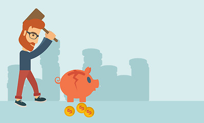 Image showing Man breaking piggy bank