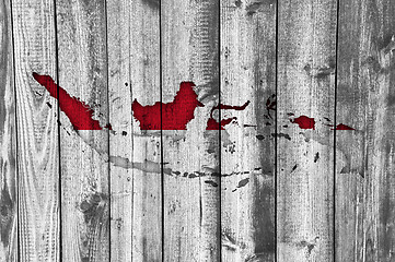 Image showing Map and flag of Indonesia on weathered wood