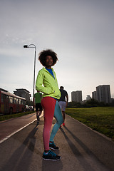 Image showing Portrait of sporty young african american woman running outdoors