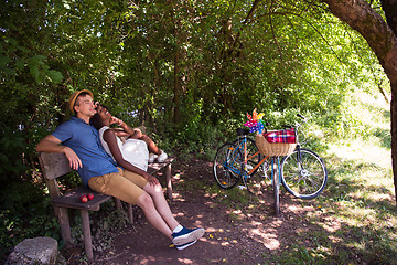 Image showing Young multiethnic couple having a bike ride in nature