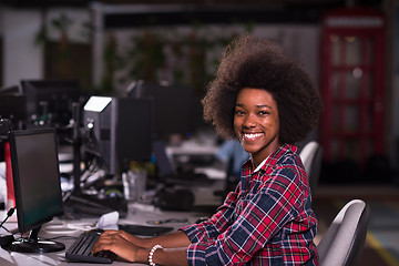 Image showing portrait of a young African American woman in modern office