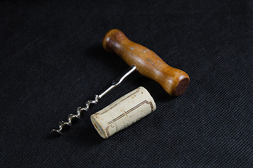 Image showing Wine cork and a corkscrew