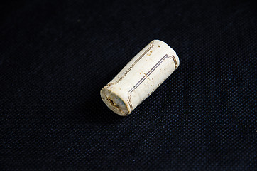 Image showing One wine cork at black surface