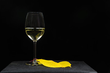 Image showing Glass of white wine at black background