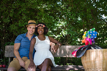 Image showing Young multiethnic couple having a bike ride in nature