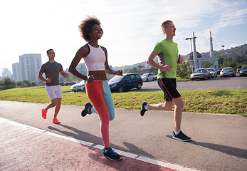 Image showing multiethnic group of people on the jogging