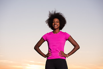 Image showing Portrait of a young african american woman running outdoors