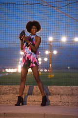 Image showing young African-American woman in a summer dress