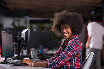 Image showing portrait of a young African American woman in modern office