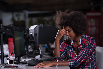 Image showing a young African American woman feels tired in the modern office