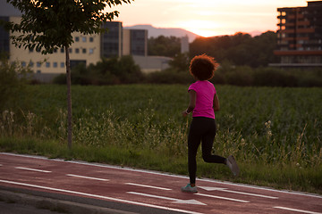 Image showing a young African American woman jogging outdoors