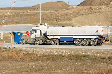 Image showing Taman, Russia - November 5, 2016: Verification of documents from the driver tank truck at security checkpoint protected area