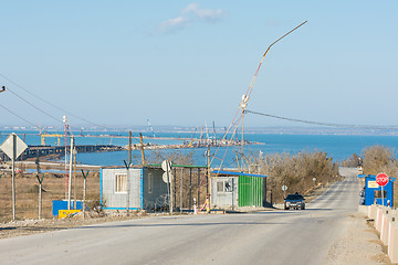 Image showing Taman, Russia - November 5, 2016: Construction of a bridge across the Kerch Strait, the control checkpoint on the road leading to the building, at the shoreline of the Taman peninsula, as of November 