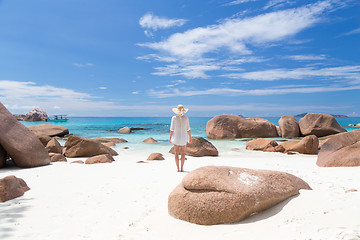 Image showing Woman enjoying Anse Lazio picture perfect beach on Praslin Island, Seychelles.