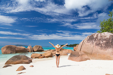 Image showing Woman enjoying Anse Lazio picture perfect beach on Praslin Island, Seychelles.