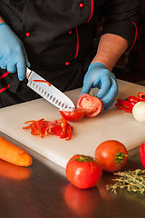 Image showing Chef cutting vegetables