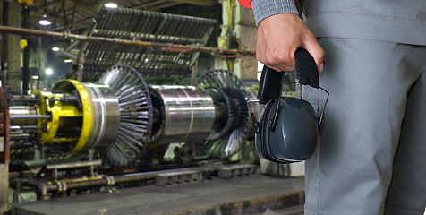 Image showing Worker with protective headphone