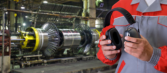 Image showing Worker with protective headphone