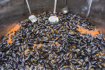 Image showing Mussels in red sauce in big cauldron on a Street market