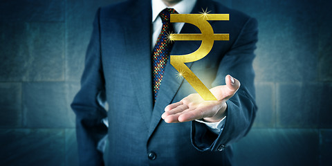 Image showing Businessman Offering A Golden Indian Rupee Symbol