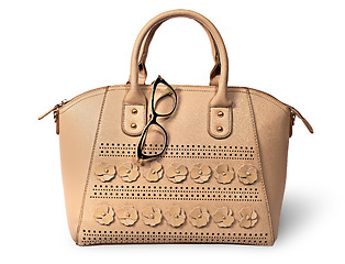 Image showing Elegant beige handbag and glasses