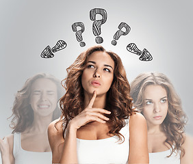 Image showing thinking women with question mark on white background