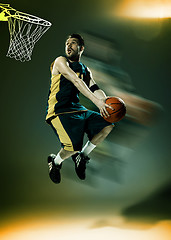 Image showing Full length portrait of a basketball player with ball