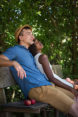 Image showing Young multiethnic couple having a bike ride in nature