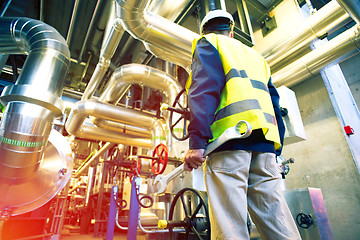 Image showing industrial worker with spanner at factory