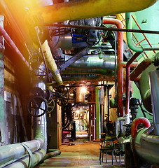 Image showing Pipes, tubes, machinery and steam turbine at a power plant