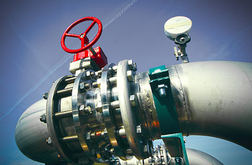 Image showing Industrial zone, Steel pipelines and valves against blue sky