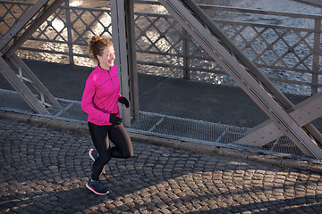 Image showing sporty woman jogging on morning