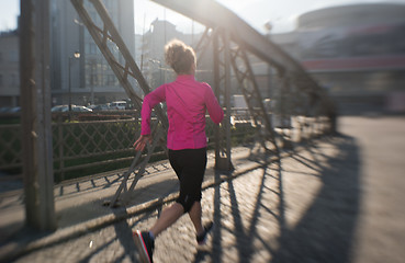 Image showing sporty woman jogging on morning