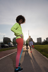 Image showing Portrait of sporty young african american woman running outdoors