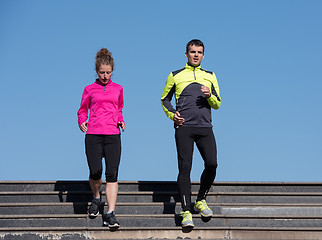 Image showing young  couple jogging on steps