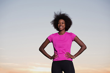 Image showing Portrait of a young african american woman running outdoors