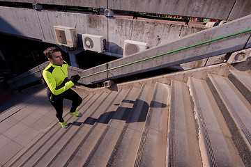 Image showing man jogging on steps