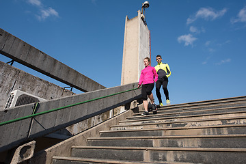 Image showing young  couple jogging on steps