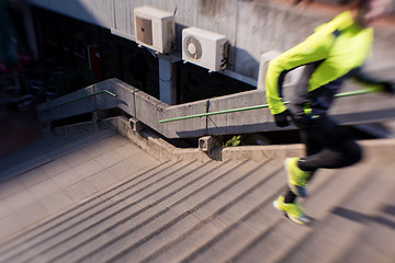 Image showing man jogging on steps