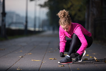 Image showing woman  stretching before morning jogging