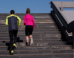 Image showing young  couple jogging on steps