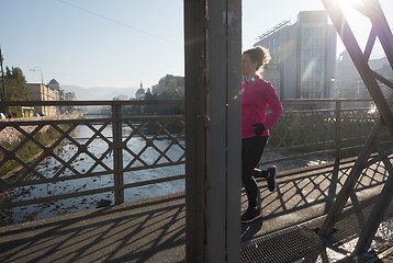 Image showing sporty woman jogging on morning