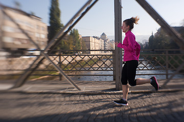 Image showing sporty woman jogging on morning