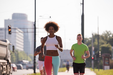 Image showing multiethnic group of people on the jogging