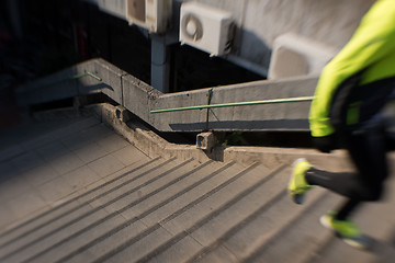 Image showing man jogging on steps