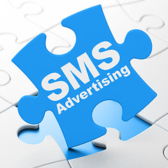 Image showing Marketing concept: SMS Advertising on puzzle background