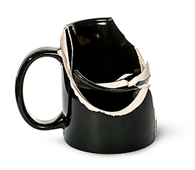 Image showing Broken black ceramic cup fragments are inside