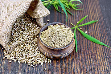 Image showing Flour hemp in bowl with grain and bag on board